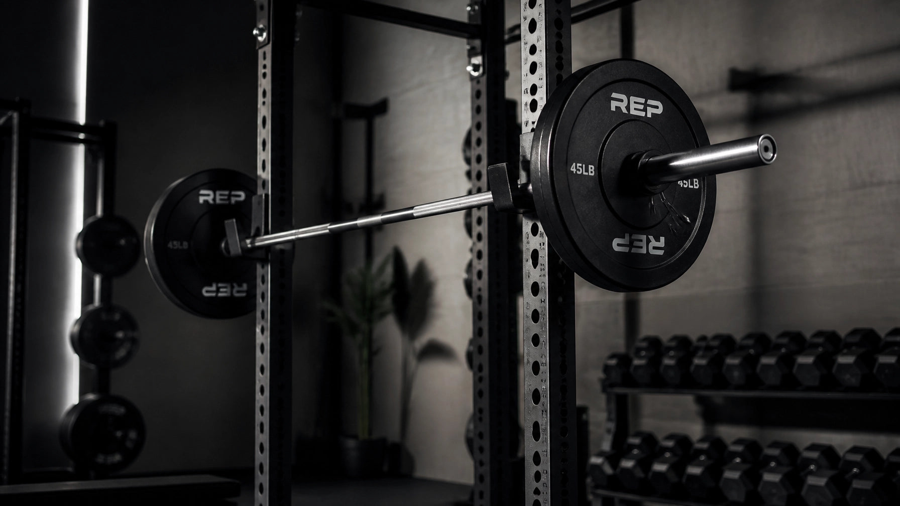 home gym setup mistakes showcased with weights and barbell in a modern fitness space.