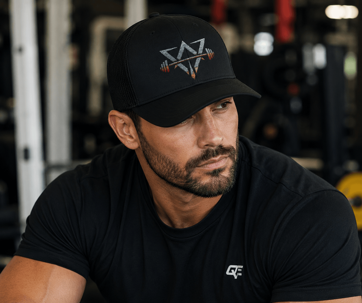 Man wearing a Qwik-Fit Snapback Trucker Cap, perfect snapback trucker cap for outdoor workouts.