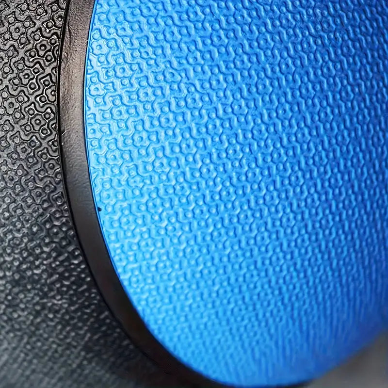 Close-up of 5kg solid rubber medicine ball showing textured surface for grip.