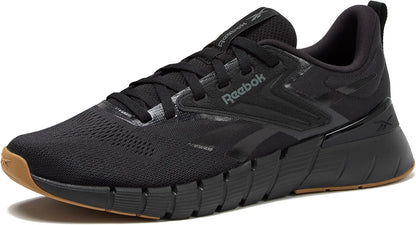 Reebok Nano Gym 1.0 men's athletic workout shoes with black and gray design, featuring supportive soles and breathable mesh material.