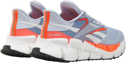 Reebok women's Floatzig running shoes in vibrant colors with breathable mesh uppers and cushioned soles for comfort.
