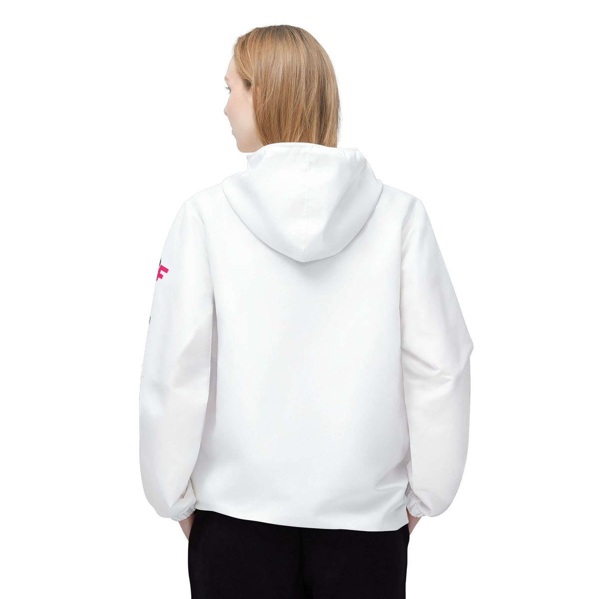 Back view of a woman wearing a white windbreaker jacket for workouts.