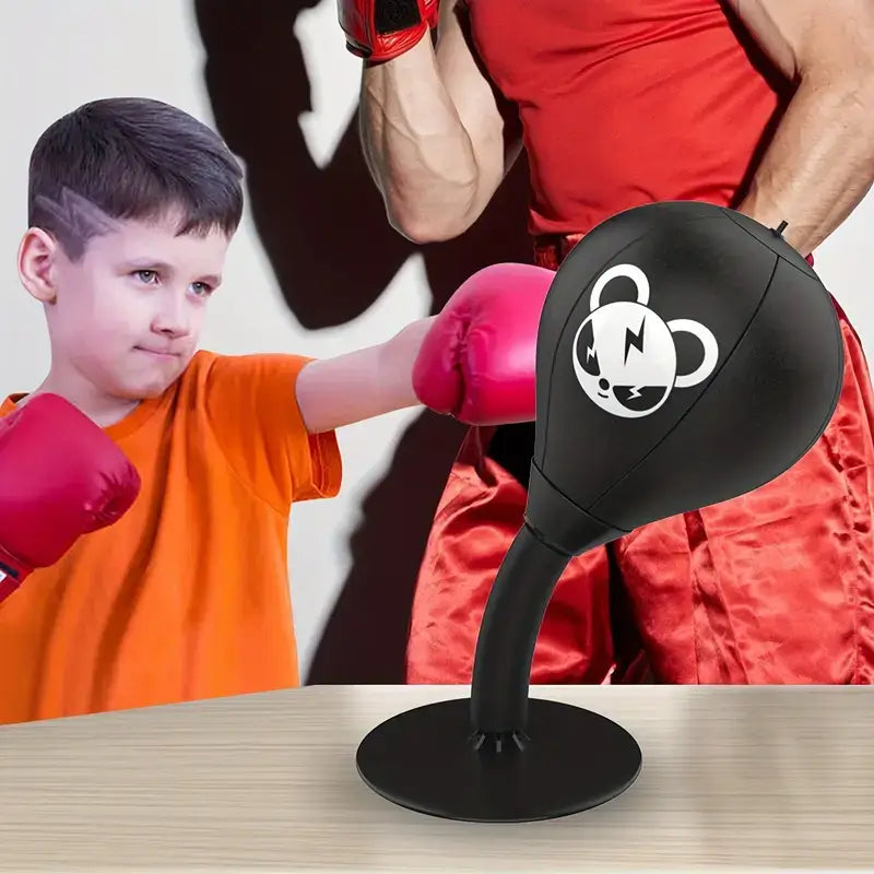 Child using a desktop boxing stress relief ball for fun exercise and stress relief in a home setting.
