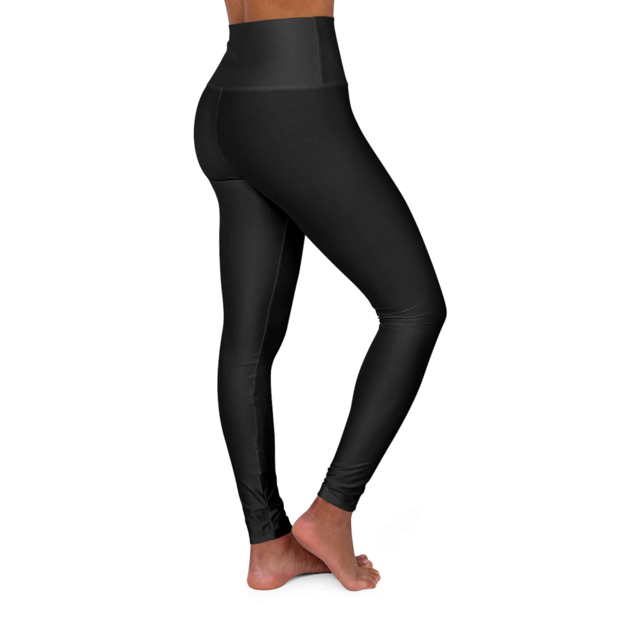 Woman wearing Qwik-Fit high-waisted yoga leggings in black, perfect for comfort and active routines.