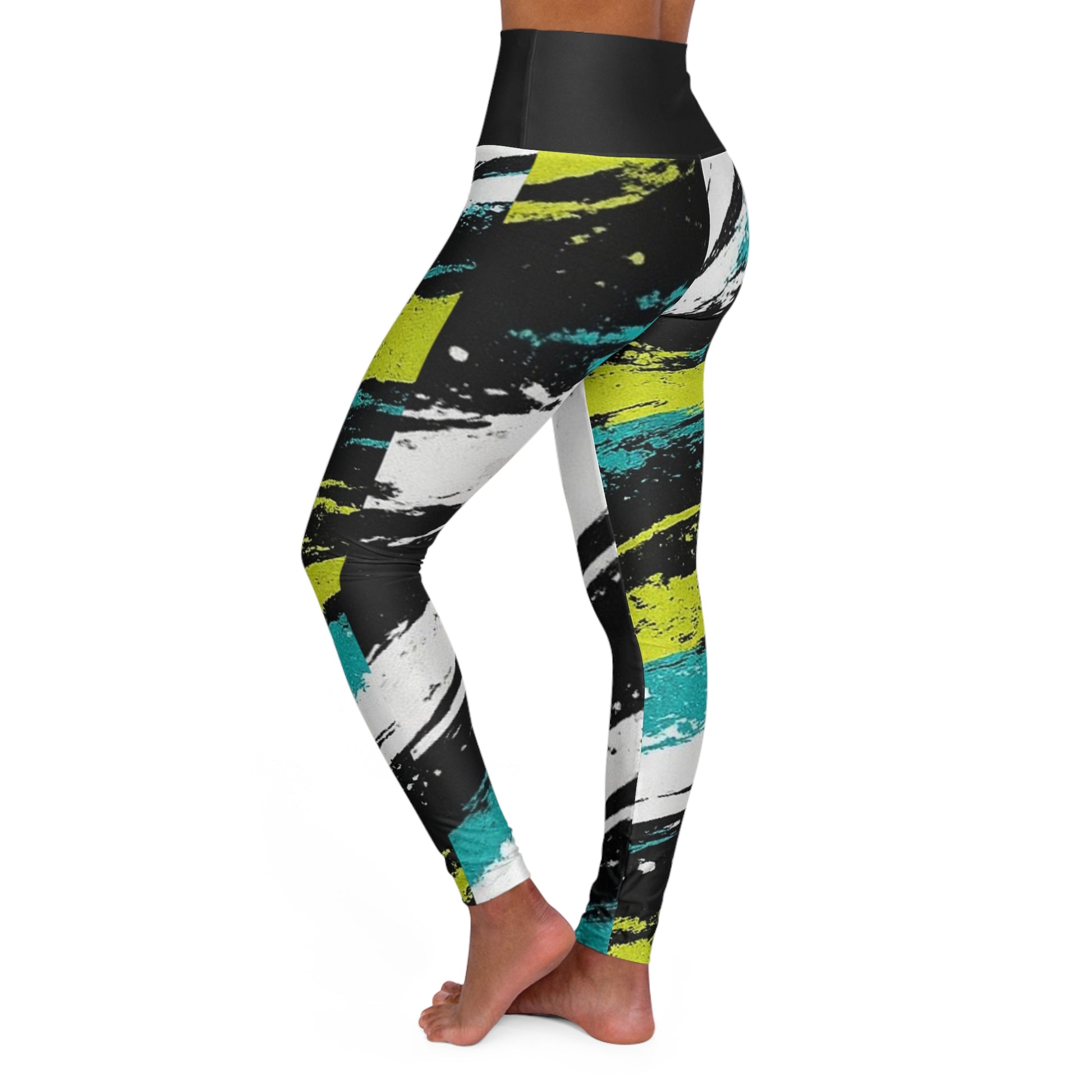 Woman wearing Brushstroke Yoga Leggings AOPy showcasing vibrant black, white, and teal design from the side.