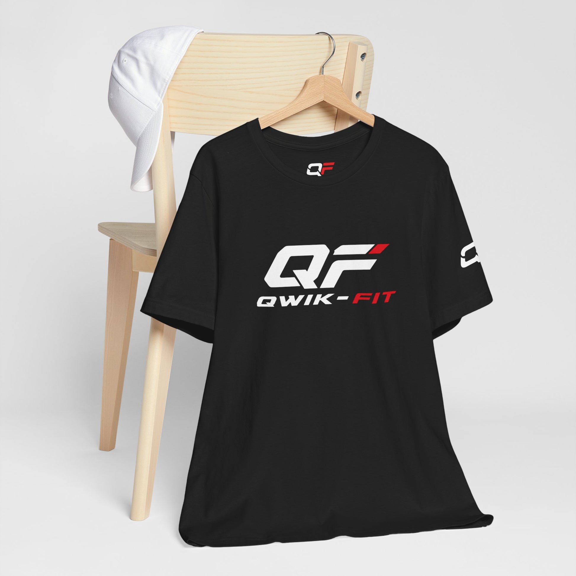 Qwik-Fit Logo Tee, a performance fitness short sleeve T-shirt by Printify, featuring the brand logo on a comfortable athletic shirt.