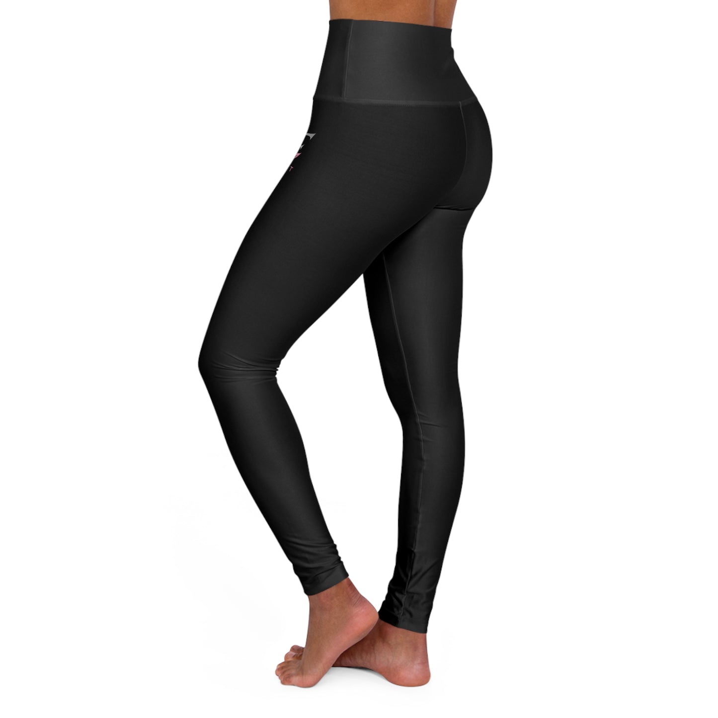 High waisted yoga leggings in black, showcasing a sleek design perfect for workouts and casual outings.
