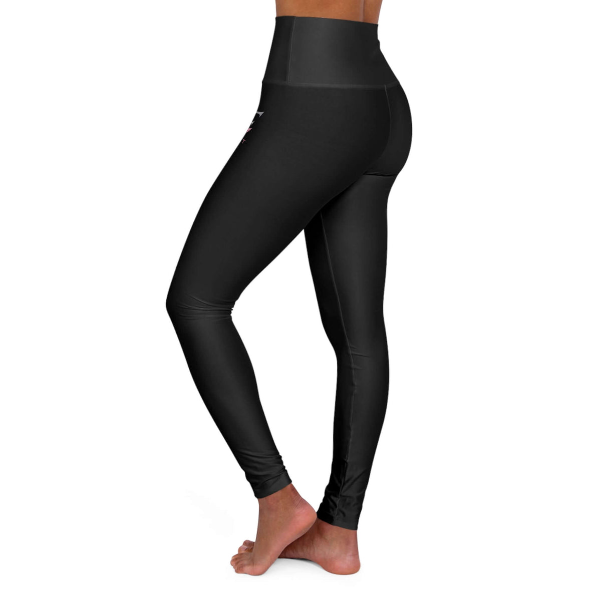 Woman wearing Qwik-Fit high-waisted yoga leggings in black, ideal for workouts and casual wear.