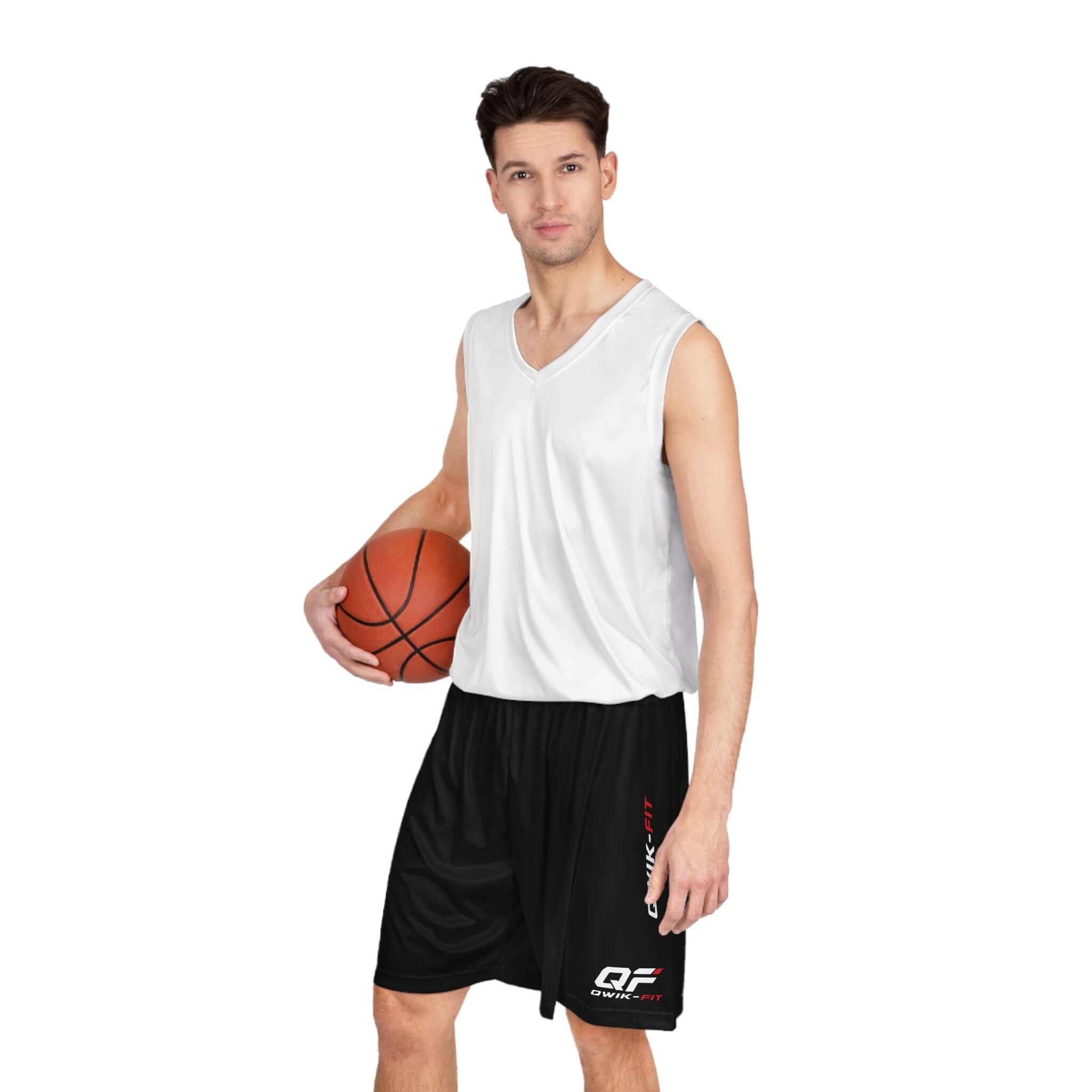Youth moisture-wicking basketball shorts worn by a young man holding a basketball, ideal for practice and training.