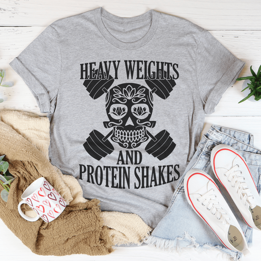 Heavy Weights And Protein Shakes Tee in Athletic Heather color, featuring unique skull and weight design on a soft cotton shirt.