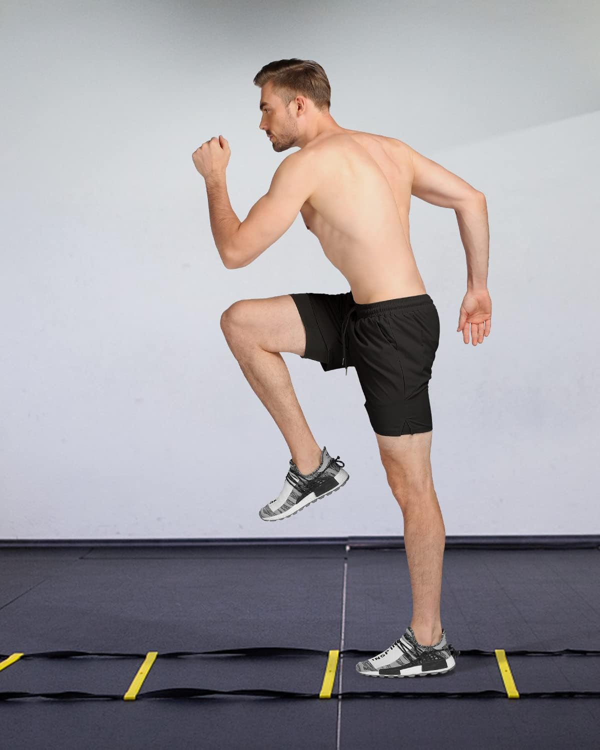 We1Fit men's 2-in-1 running shorts with quick-dry fabric, phone pockets, black color, designed for athletic gym workouts.