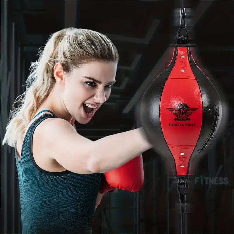 Woman training with double end bag for MMA training, enhancing speed and agility with a red punching ball.