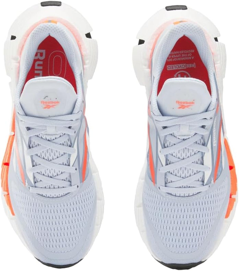 Reebok women's Floatzig running shoes in vibrant colors, featuring breathable mesh upper and cushioned sole for comfort.