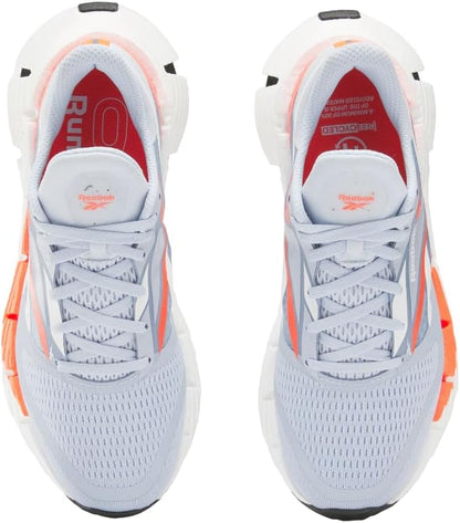 Reebok women's Floatzig running shoes in vibrant colors, featuring breathable mesh upper and cushioned sole for comfort.