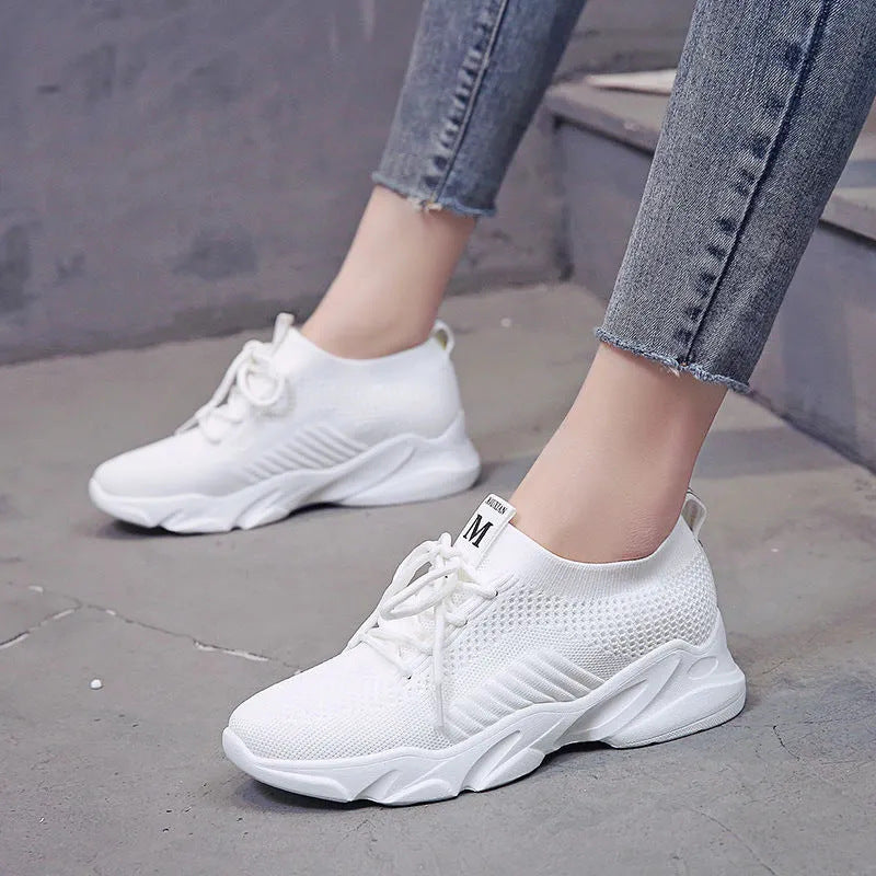 Women's casual sports sneakers in white, perfect for running and walking, featuring a stylish mesh upper and lightweight design.