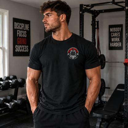 Champion unisex cotton t-shirt worn by a man in a gym setting with weights and motivational posters.