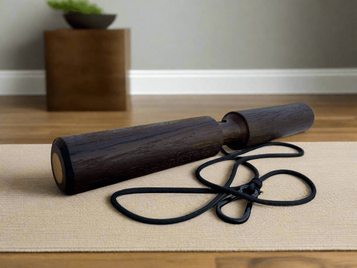 Smoked Oak Wrist Roller with Rope and Carabiner on exercise mat, ideal for home workouts and fitness routines.