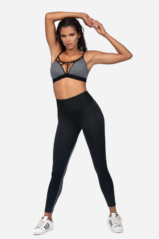 Comfortable sports bra for fitness worn with stylish black leggings, perfect for workouts and casual wear.