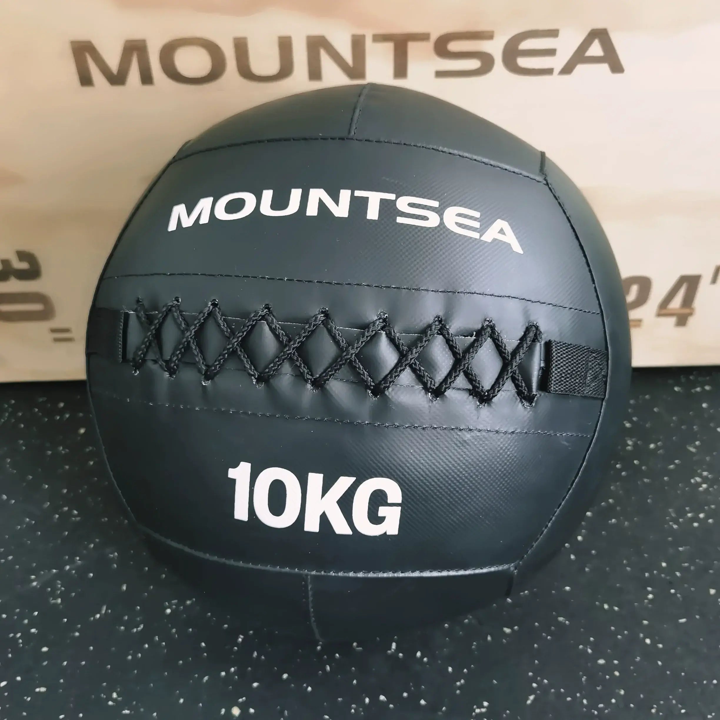 10kg soft medicine ball on a black surface with Mountsea branding, designed for effective workouts and training.