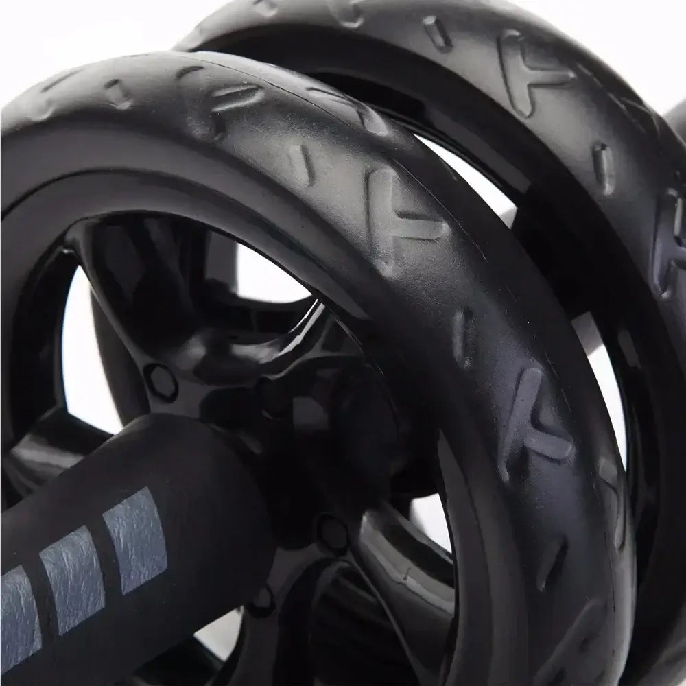 Close-up of 15 cm non-slip double-wheel ab roller wheels showcasing durable design and traction.