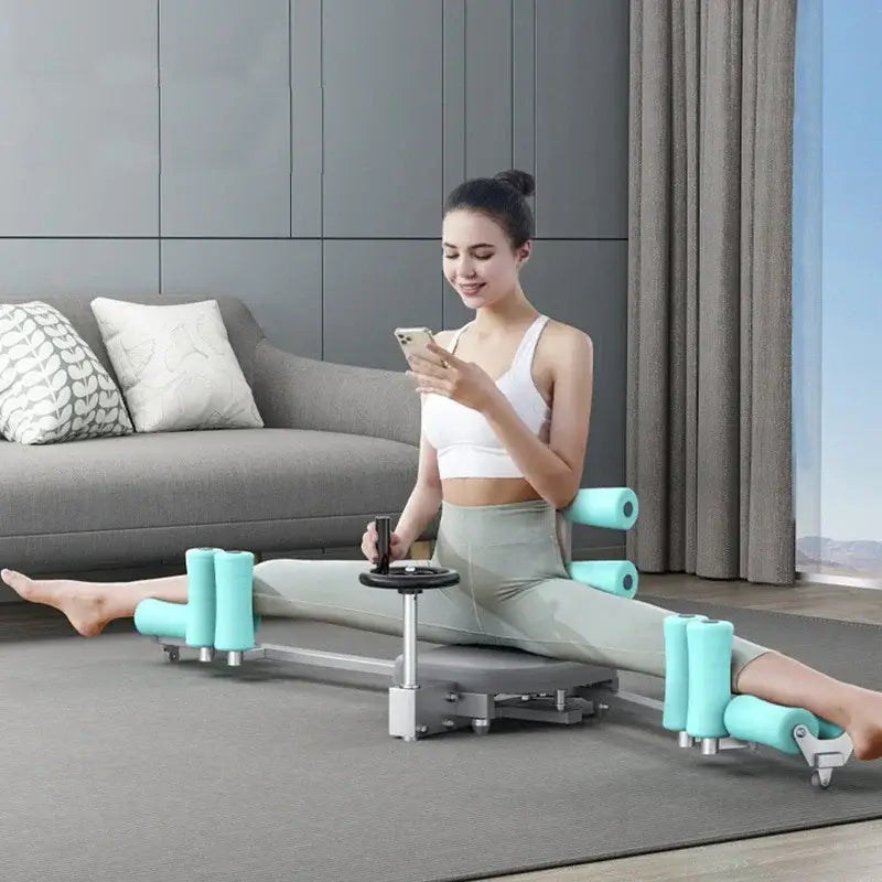 Woman using heavy duty leg split stretcher machine for yoga and fitness at home.