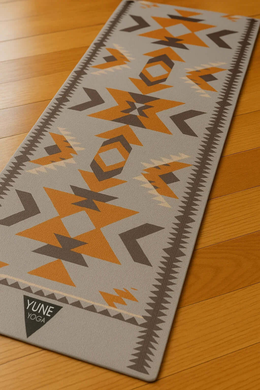 Yune Yoga mat with geometric patterns on a wooden floor; eco-friendly double-sided yoga mat design.