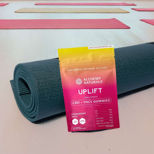 CBD Uplift Gummies for Mood & Workout on a yoga mat, highlighting wellness benefits for workouts and mood enhancement.