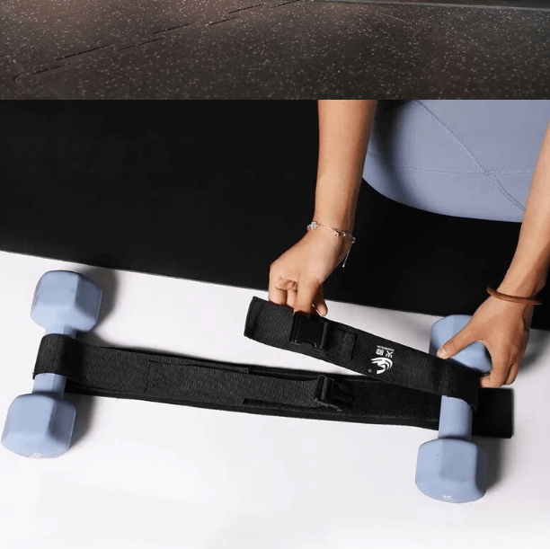 Hip thrust belt for booty workouts being prepared with dumbbells for effective fitness training.