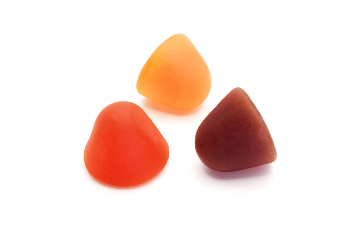 Daily multivitamins for men in gummy form, featuring various colors: orange, red, and brown.
