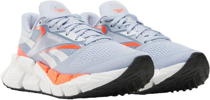 Reebok women's Floatzig running shoes with breathable mesh and cushioned sole, designed for comfort and performance.