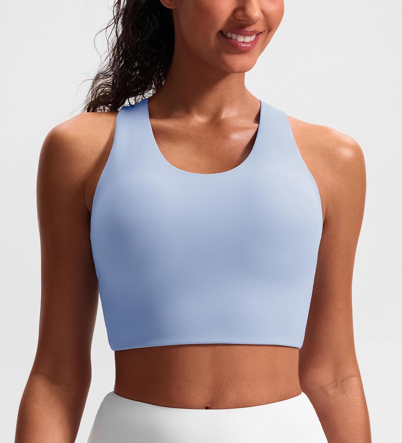 JOYSPELS women's sports bra with criss-cross back design, padded workout tank top, medium support crop top for active wear.