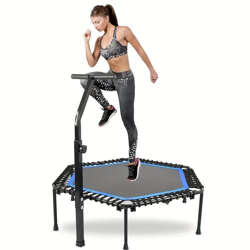 Woman exercising on a rebounder mini trampoline with adjustable handle bar in a fitness outfit.