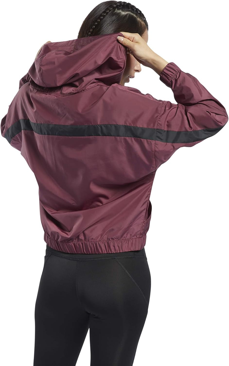 Reebok women's workout ready hooded jacket in black with front zipper and sporty design, suitable for activewear and casual wear.