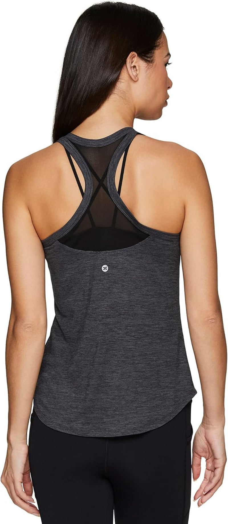 RBX Active women's sleeveless athletic tank top with mesh ventilation, designed for running, workout, and yoga.