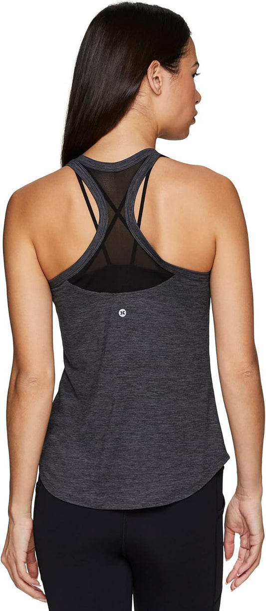 RBX Active women's sleeveless athletic tank top with mesh ventilation, designed for running, workout, and yoga.