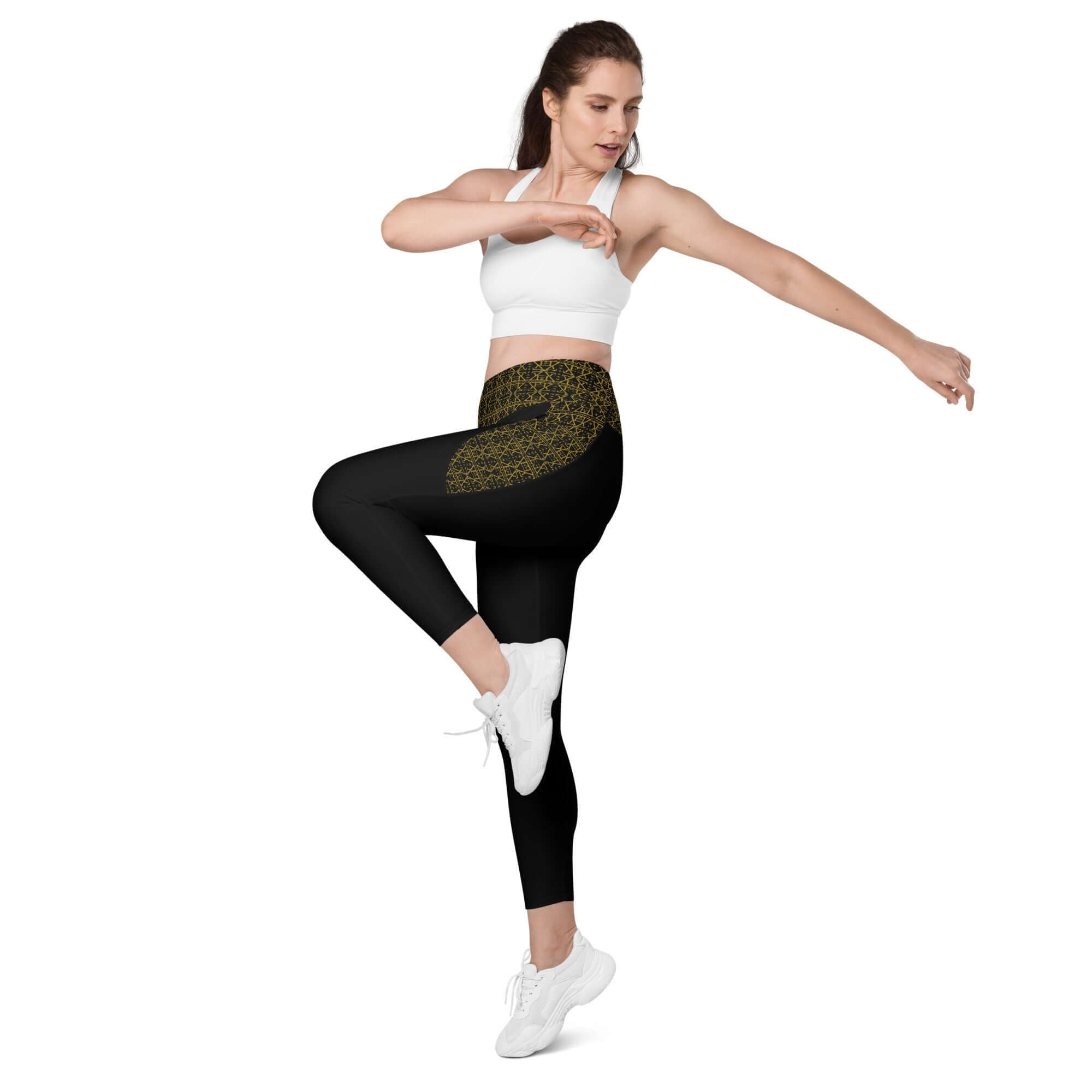 Model demonstrating yoga leggings with pockets in a stylish black design, perfect for fitness activities.