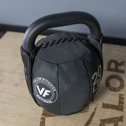 Fitness Essentials soft kettlebell in 10 lbs (4.5 kg) for strength training, shown on a workout surface.