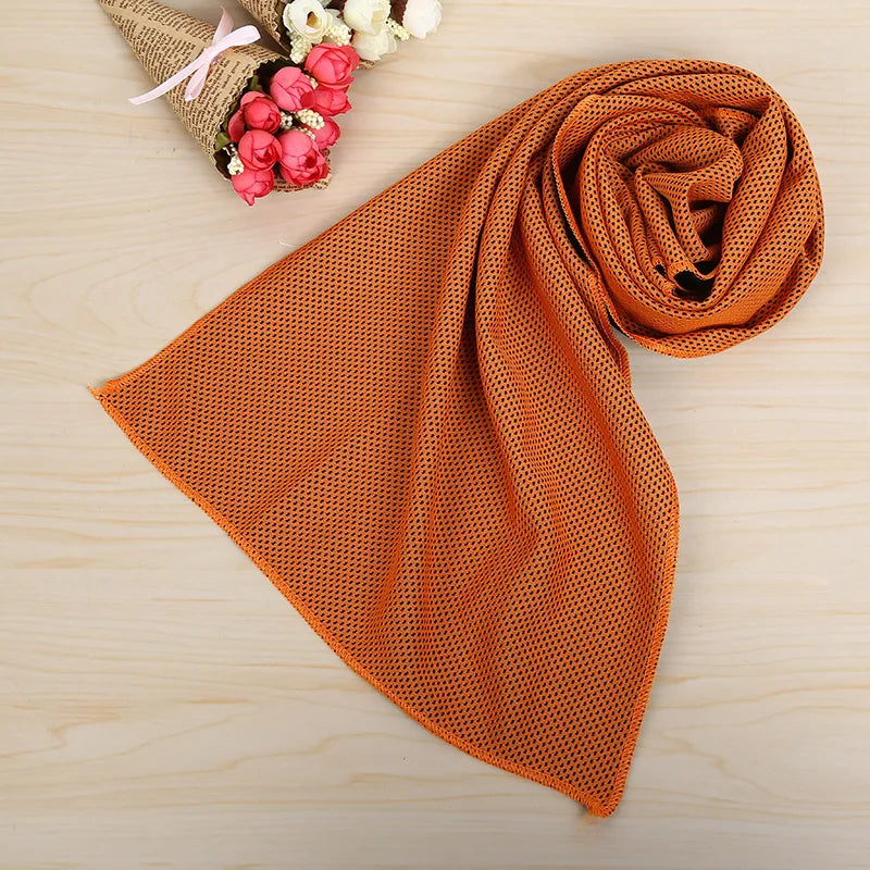 Fitness Essentials microfiber ice towel shown outdoors, designed for quick-drying cooling comfort during sports and fitness activities.