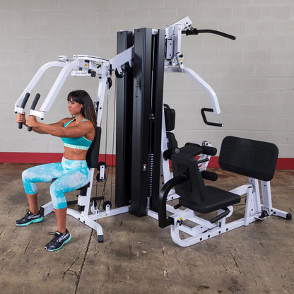 Body Solid EXM3000LPS commercial double stack gym with three workout stations and multiple weight stacks for full-body training.