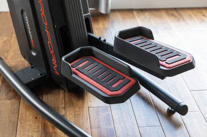 Fitness Essentials Trainer H7 iFit-enabled elliptical with 7-inch touchscreen and built-in fan, showing the elliptical’s console and design.