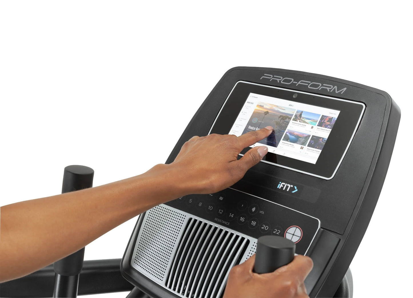 Fitness Essentials Trainer H7 iFit-enabled elliptical with 7-inch touchscreen and built-in fan, displayed in a modern gym setting.