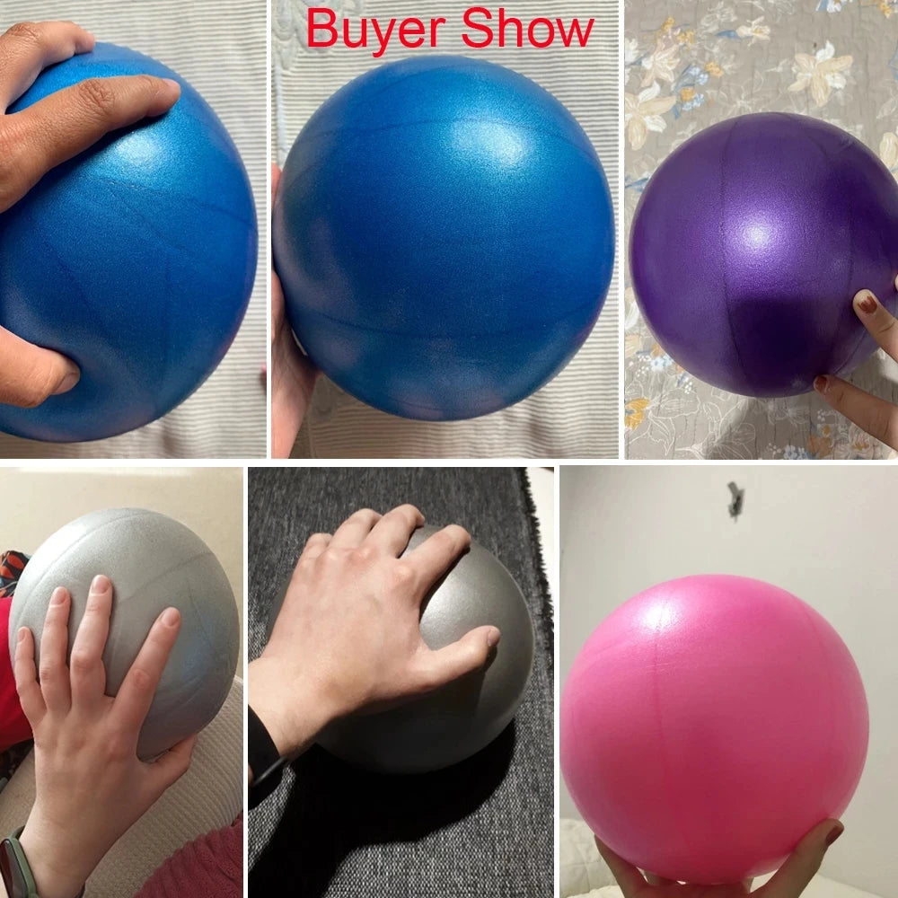 Pink 25cm Fitness Essentials yoga ball used for Pilates, core training, and home workouts, shown on a gym floor.