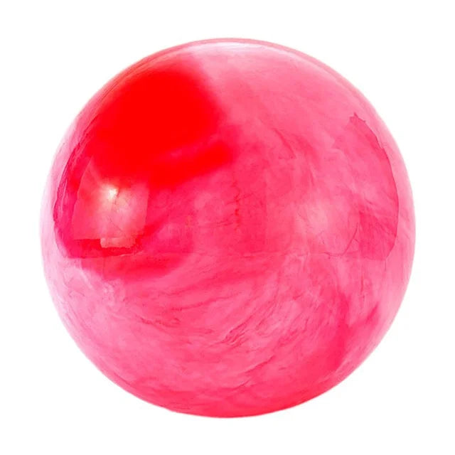 Pink 25cm Fitness Essentials yoga ball for Pilates, core training, and home workouts, shown on a clean workout mat.