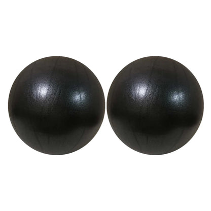 Pink 25cm Fitness Essentials yoga ball for Pilates, core training, and home workouts, shown inflated on a gym mat.