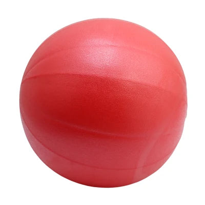 Pink 25cm Fitness Essentials yoga ball for Pilates, core training, and home workouts, shown inflated and ready for exercise.