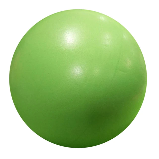 Pink 25cm Fitness Essentials yoga ball ideal for Pilates, core training, and home workouts, shown on a clean workout mat.