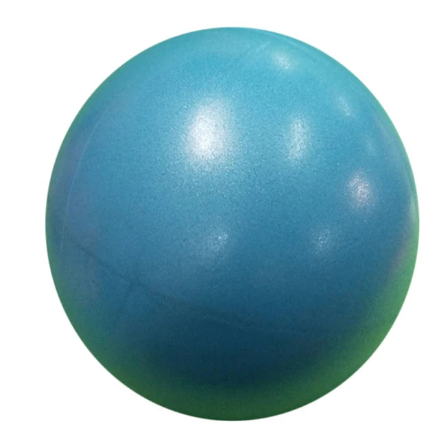 Pink 25cm Fitness Essentials yoga ball used for Pilates, core training, and home workouts on a gym floor.