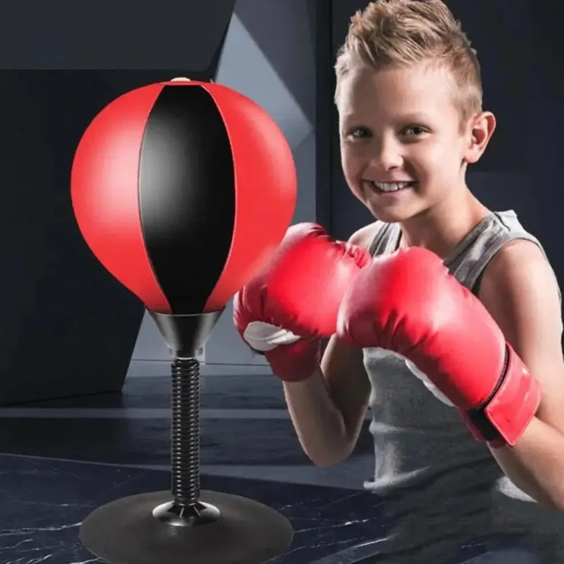 Red stress reliever punching bag toy for children with suction cup, desk boxing ball for reducing tension and stress.