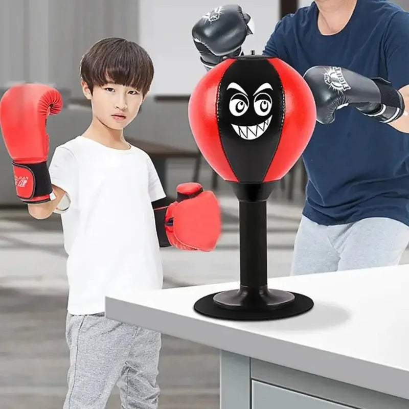 Red children's stress reliever punching bag with suction cup, desk boxing toy, and punch ball for reducing tension.