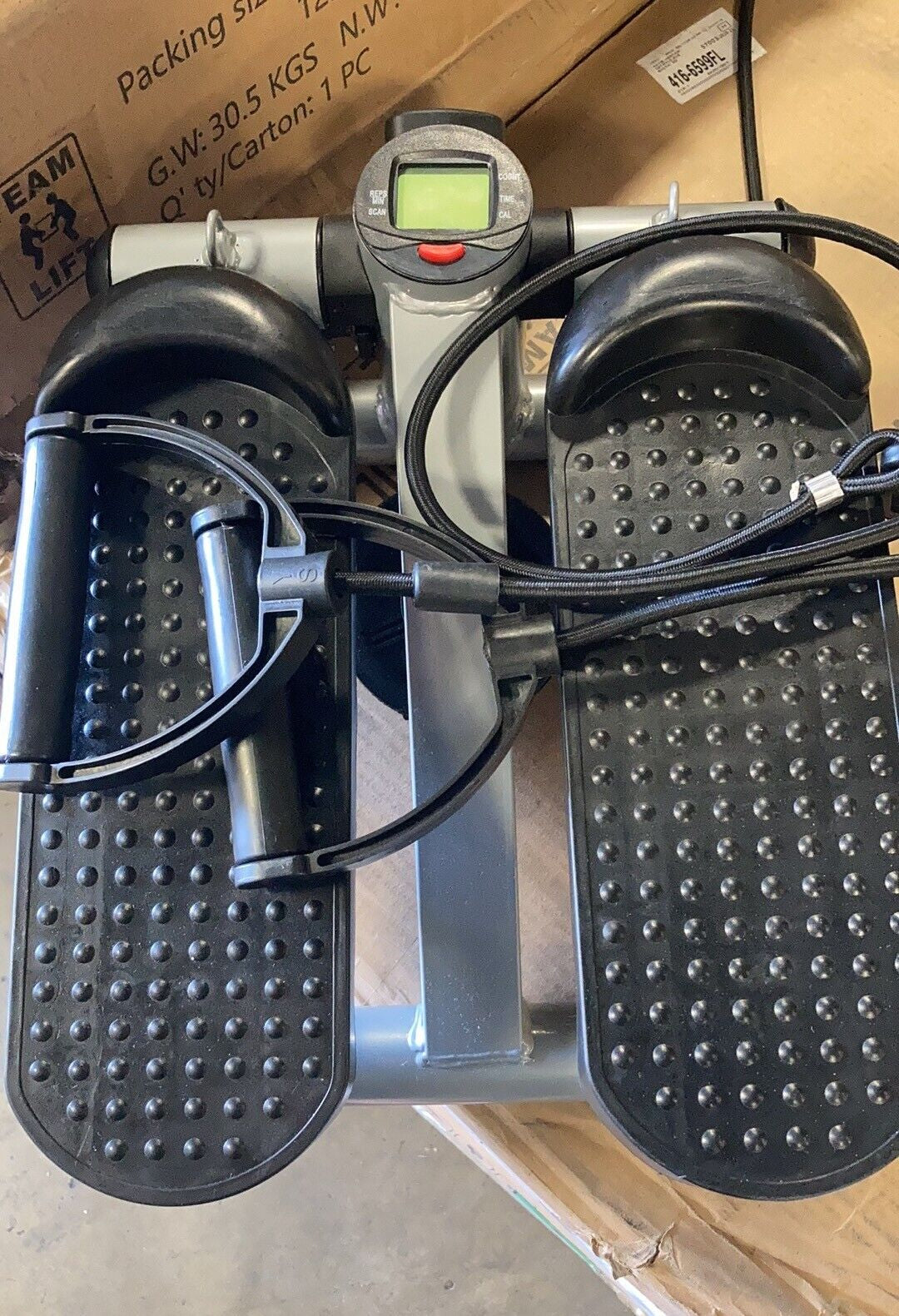 White Fitness Essentials mini stepper exercise machine with resistance bands and LCD display for home cardio workouts.
